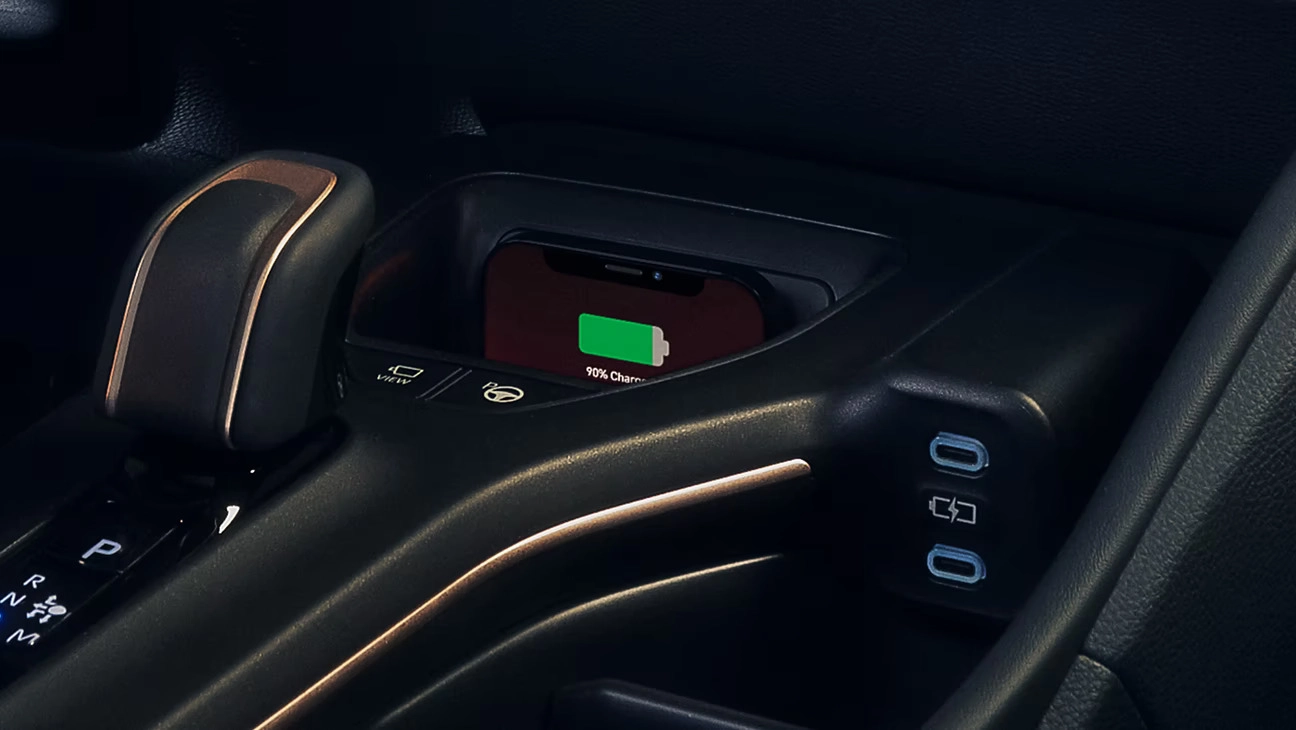 Qi-compatible wireless charging shown. Platinum interior shown in Black leather trim. Prototype shown with options.