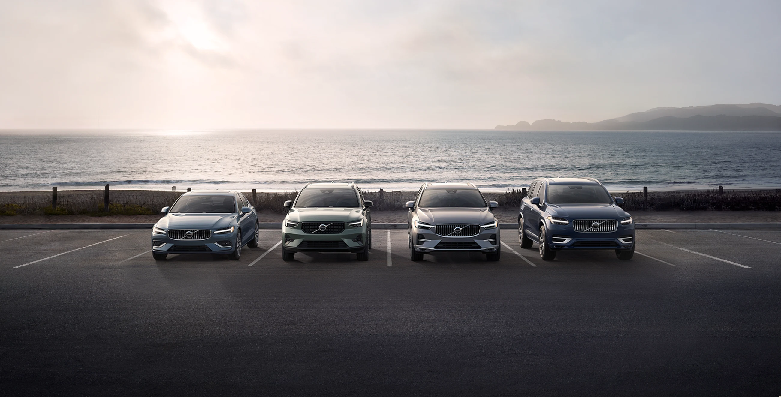 Picture of Volvo Vehicles lined up in parking lot.