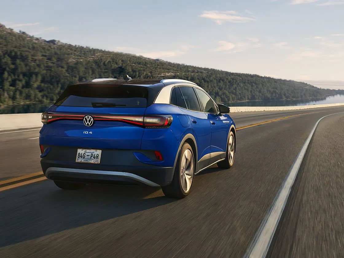 2022 Volkswagen ID.4 Exterior view of blue ID.4 driving outside on a sunny day
