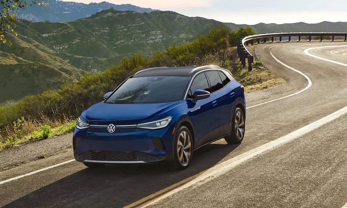 2022 Volkswagen ID.4 Exterior view of blue ID.4 driving outside on a sunny day