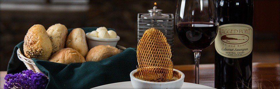 glass of wine with bread rolls