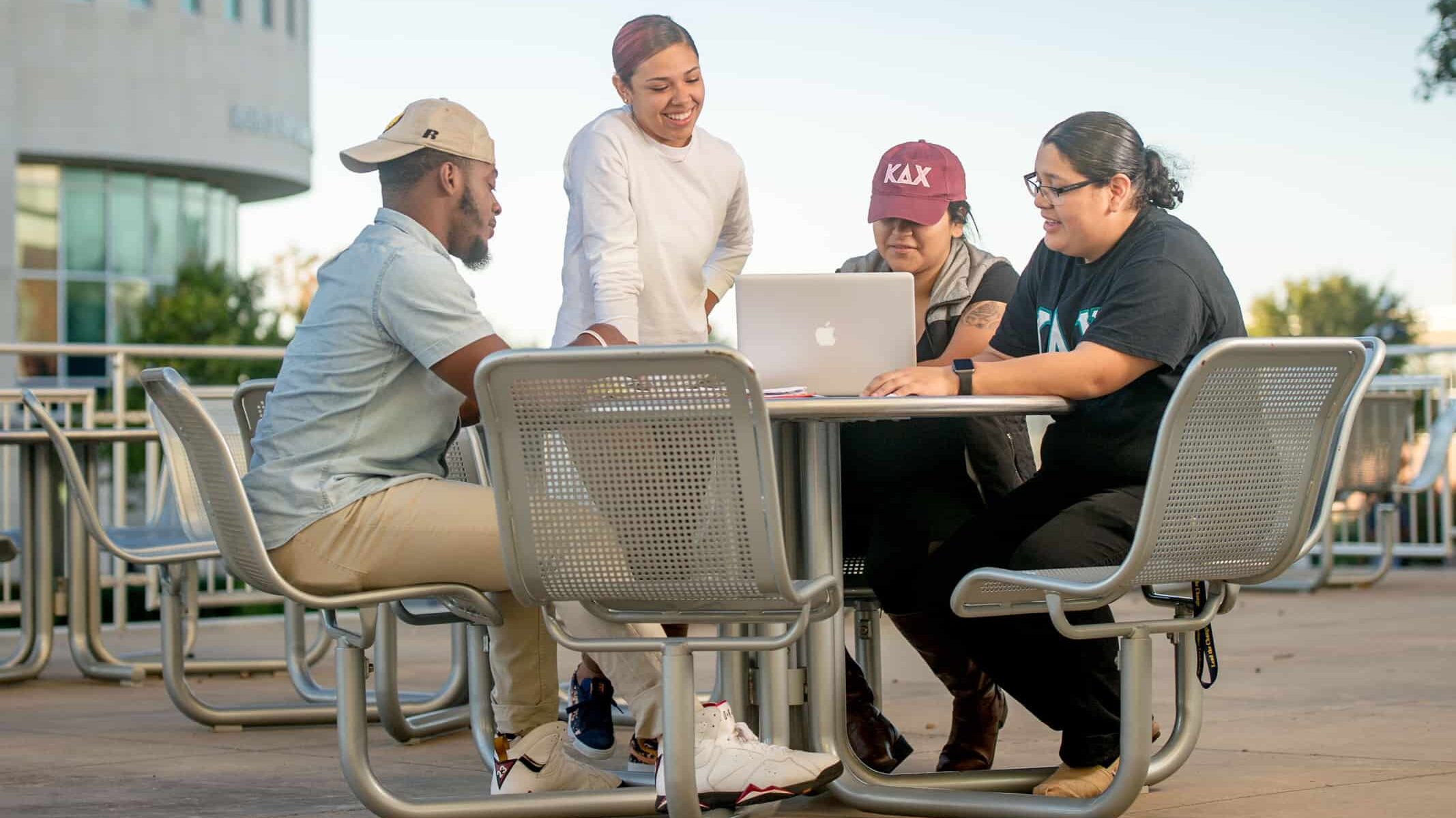 Students studying outside on campus.