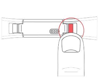 Tracker facedown with the button highlighted to detach the band, where the band meets the housing