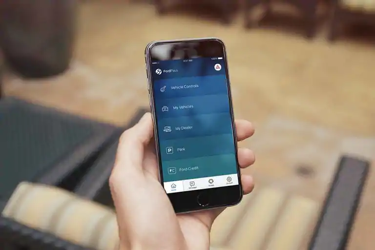 person using ford's FordPass smartphone app