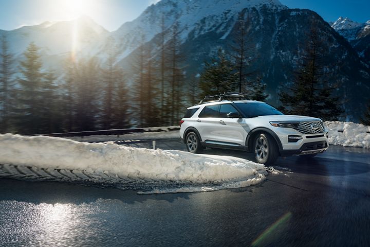 white 2020 ford explorer driving in the mountains