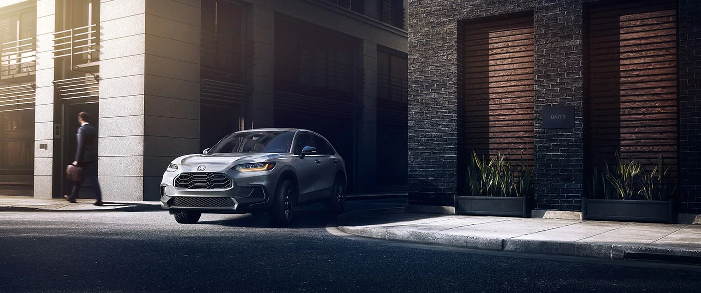 2023 Honda HR-V pulling out of an alleyway.