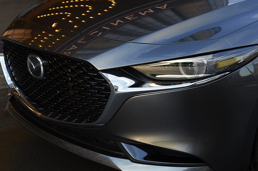 closeup of the front of a grey 2019 mazda3 sedan