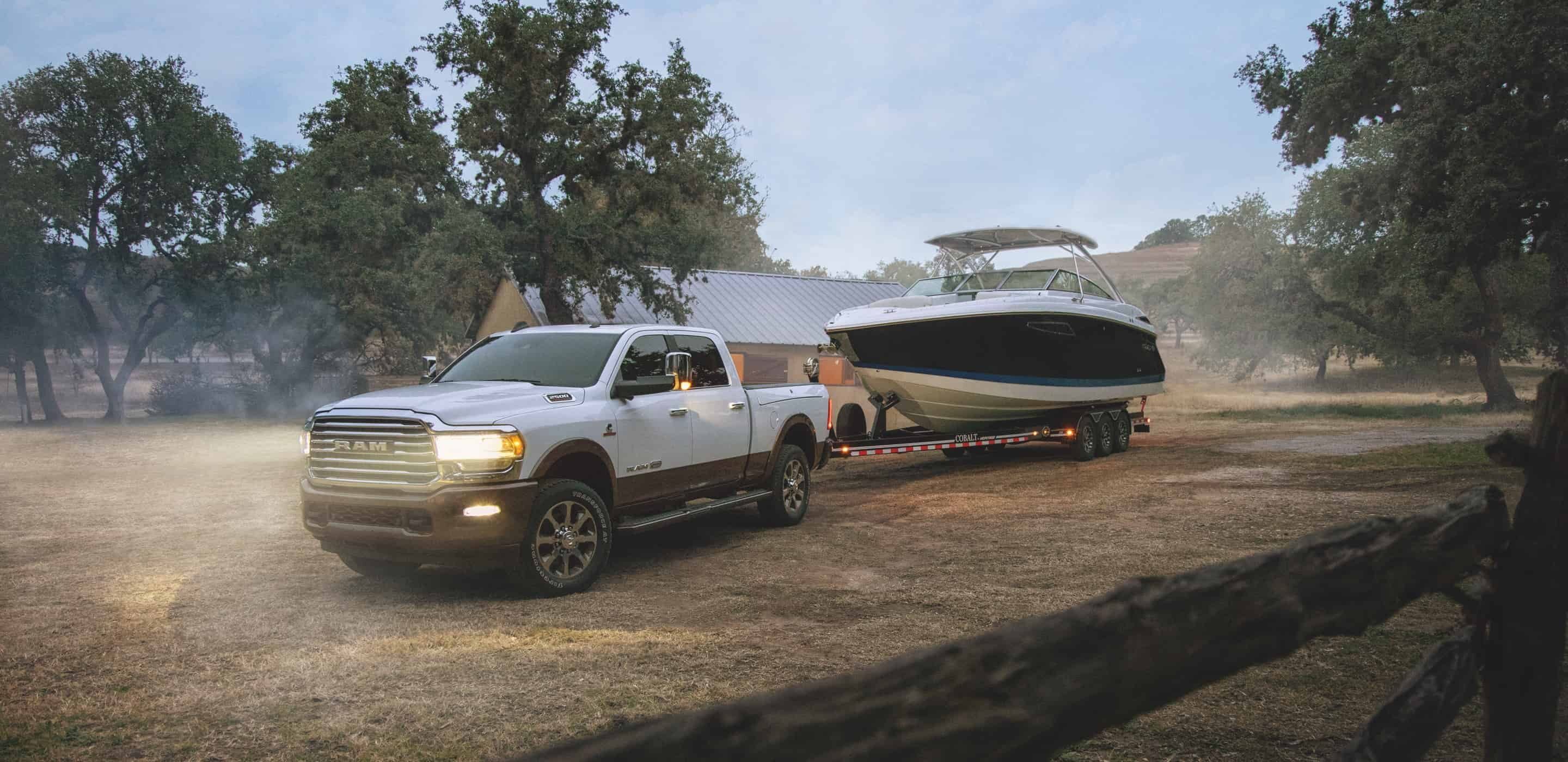 white 2020 ram 2500 towing a boat