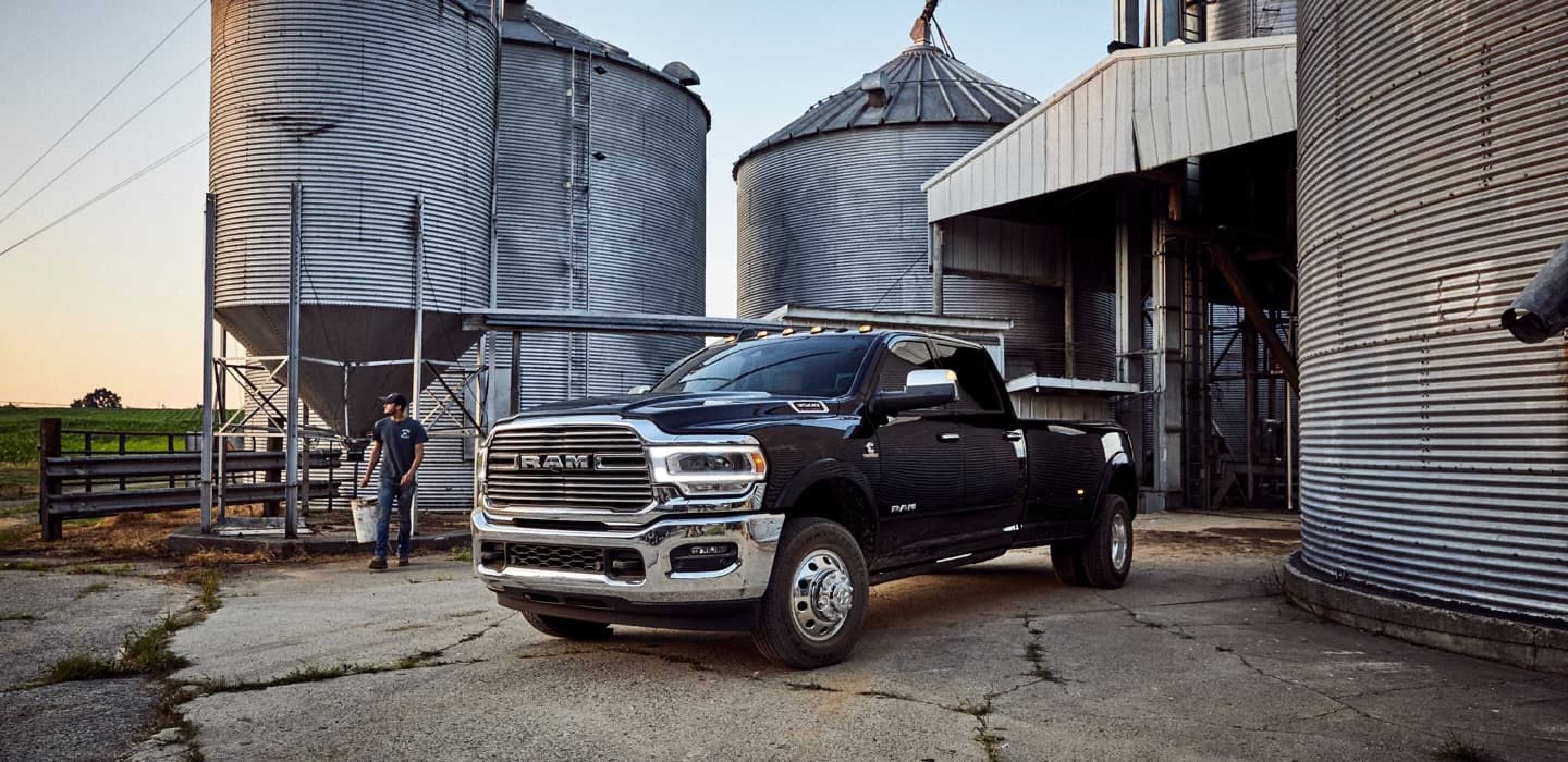 black 2020 ram 1500 parked by silos on a farm