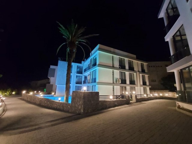 AN APARTMENT FOR SALE ON A SITE WITH A 2 + 1 COMMUNAL POOL WITH SEA AND MOUNTAIN VIEWS IN KYRENIA LAPTA, CYPRUS ** 