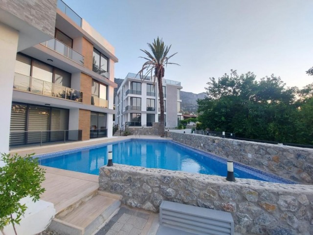 AN APARTMENT FOR SALE ON A SITE WITH A 2 + 1 COMMUNAL POOL WITH SEA AND MOUNTAIN VIEWS IN KYRENIA LAPTA, CYPRUS ** 