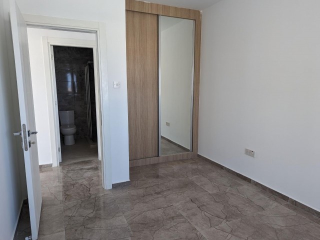 IN ALSANCAK, 1+1, IN A VERY GOOD LOCATION, IN A SITE WITH SHARED POOL, NEWLY FINISHED LUXURY FLAT OF 70 SQUARE METERS.