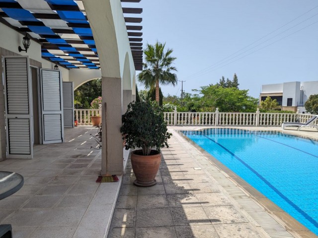 IN GIRNE BEYLERBEYİ (BELLAPAİS), IN A GREAT LOCATION WITH A VERY HIGH PREFERENCE RATE, BUILT ON A LARGE PLOT OF 1445 SQUARE METERS WITH EQUIVALENT KOÇANLI, WITH 5X10 SWIMMING POOL, CENTRAL HEATING SYSTEM INCLUDING HOBBERS FINISHED, AIR CONDITIONED, FULLY NEWLY FURNISHED, WITH AN ACTIVE WATER WELL IN