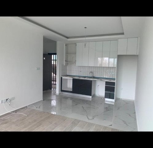 1+1 FLAT IN ALSANCAK WITHIN QUALIFIED SITE AND WALKING DISTANCE TO THE SEA ** 