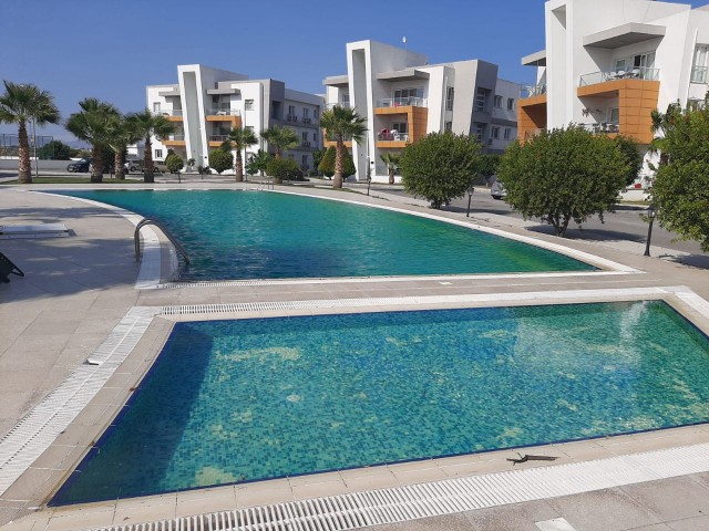 Famagusta Saklikentte zu verkaufen 75 m2 2+1 Wohnung Erdgeschoss Gemeinschaftspool zum Verkauf 55,000 Llogara ** 