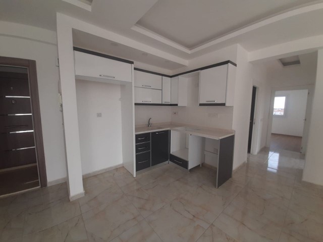 2+1 flats for sale in iskele long beach unfurnished flats 85 square meters 130.000 STG WALKING DISTANCE TO THE SEA QUALITY WORKMANSHIP 3rd floor flat is at the back.