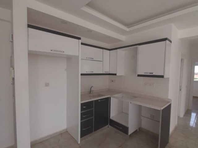 2+1 flats for sale in iskele long beach unfurnished flats 85 square meters 130.000 STG WALKING DISTANCE TO THE SEA QUALITY WORKMANSHIP 3rd floor flat is at the back.