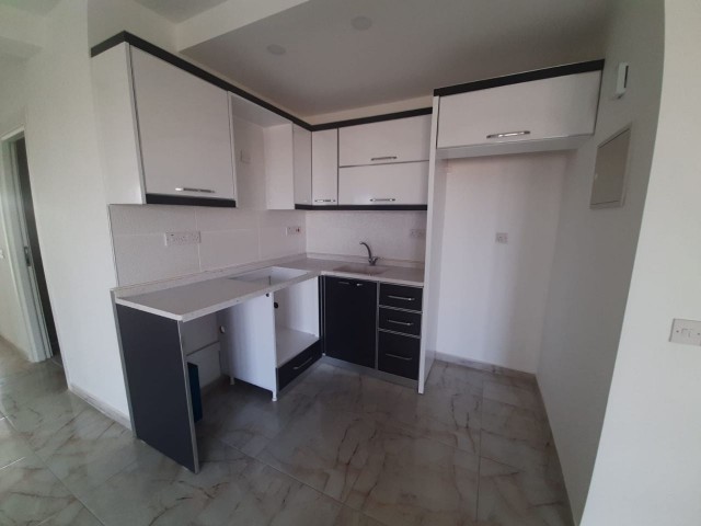 2+1 flats for sale in iskele long beach unfurnished flats 85 square meters 130.000 STG QUALITY WORKMANSHIP WALKING DISTANCE TO THE SEA. FLAT IS ON THE 1st FLOOR.