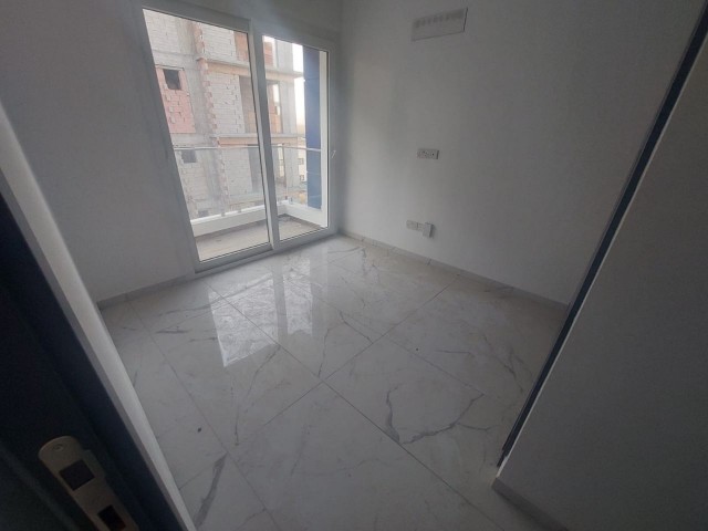 İskelede satılık 2+1 apartman dairesı 4.katta son 1 adet full eşyalı 115,000£ 75 metre kare 