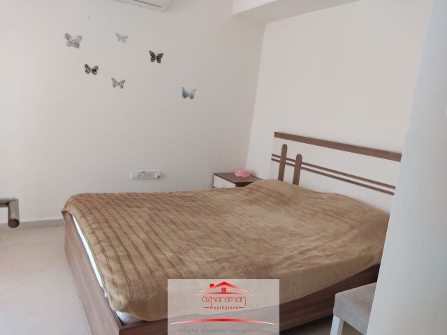 ÖZKARAMAN'dan  İskele-Boğaz Caesar Beach de kiralık 2+1 Daire