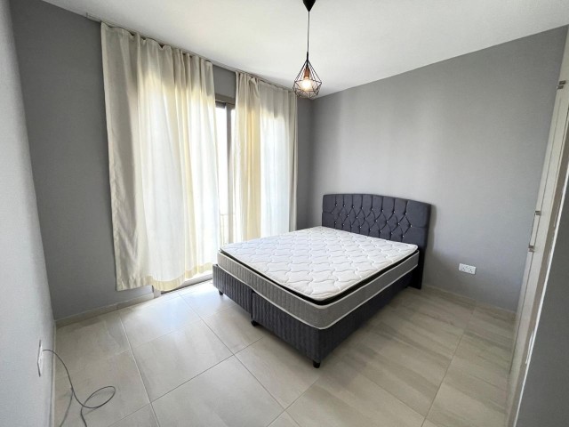 FULLY FURNISHED 2+1 APARTMENT WITH ITS OWN PRIVATE GARDEN IN OLIVE GİRNĖNLİK