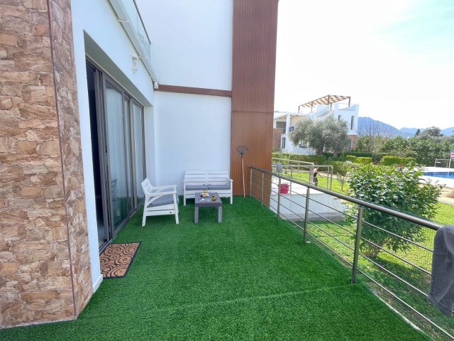 FULLY FURNISHED 2+1 APARTMENT WITH ITS OWN PRIVATE GARDEN IN OLIVE GİRNĖNLİK