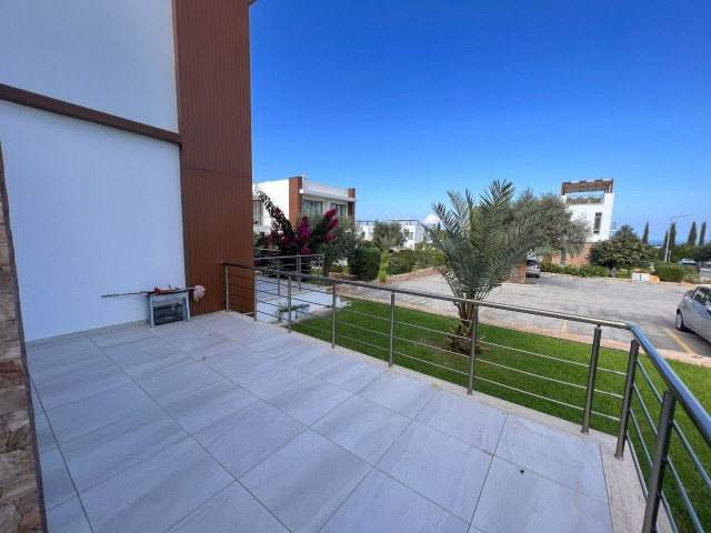 2+1 FLAT FOR SALE WITH LARGE GARDEN AND BALCONY IN A SITE WITH COMMON POOL IN CYPRUS GIRNE ZEYTİNLİK