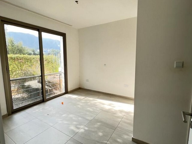 2+1 VILLA-LIKE FLATS FOR SALE WITH PRIVATE GARDEN AND ENTIRE BATHROOM IN A SITE WITH POOL IN CYPRUS GIRNE ZEYTİNLİK AREA