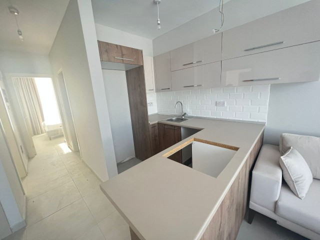 2+1 FLATS FOR SALE IN CYPRUS GIRNE ALSANCAK REGION WITH CLOSED PARKING PARKING, TERRACE, MOUNTAIN, SEA VIEW, TURN KEY AFTER 50% PAYMENT, 12 MONTHS MAINTENANCE.