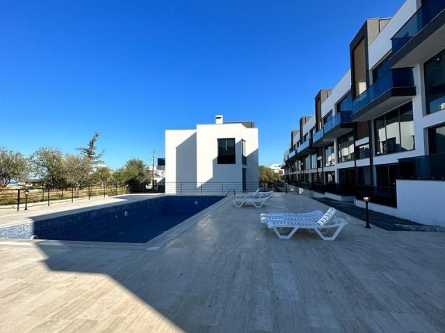 3+1 FLATS FOR SALE IN CYPRUS GIRNE ALSANCAK AREA, WITHIN A SITE WITH A POOL, WITH TERRACE OR GARDEN FLOOR OPTIONS, WITH MOUNTAIN AND SEA VIEWS, OFFERING A TURN KEY 12 MONTHS PAYMENT AFTER 50% PAYMENT.