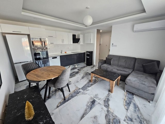 FULLY FURNISHED 1+1 FLAT FOR SALE IN A SITE WITH SHARED POOL IN GIRNE/ALSANCAK