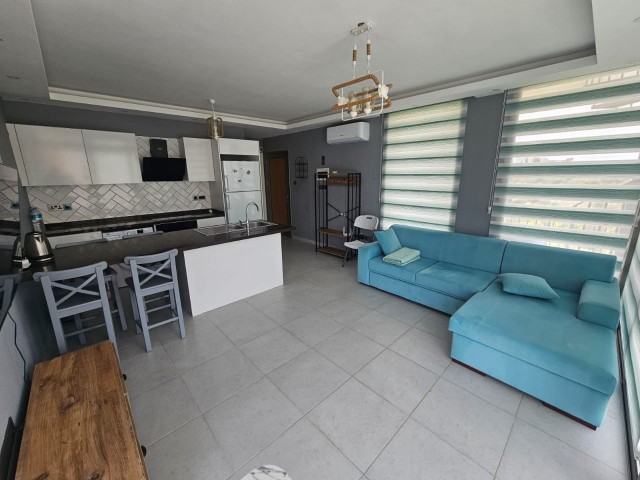 1+1 FURNISHED PENTHOUSE FOR SALE IN A SITE WITH COMMON POOL IN GIRNE/ALSANCAK