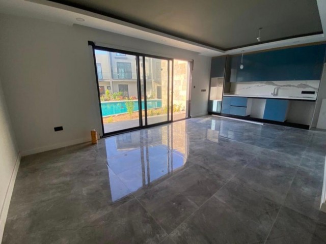 2+1 FLAT FOR SALE IN GIRNE KARAOĞLANOĞLUN SITE WITH POOL