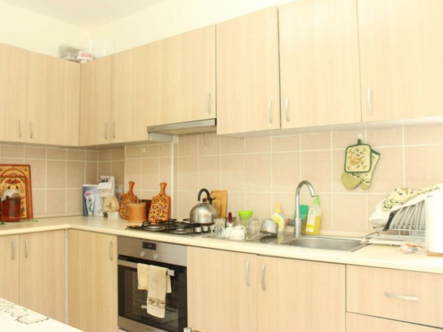 Apartment for sale in Alsancak 3 + 1 in municipal area, furnished, ground floor, garden, 7-year building