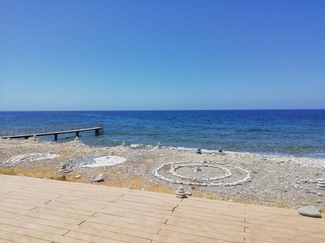 Kyrenia - Esentepe, furnished, 2+1 flat with white goods and private garden. It is 300 meters from the sea. We can speak Turkish, English and Russian.