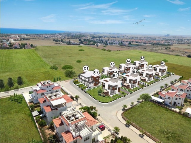 In Iskele - Bahçeler, in a complex with a pool, 700 meters from the sea, twin villas with 3+1 rooms, 178 square meters, are for sale. We can speak Turkish, English and Russian.