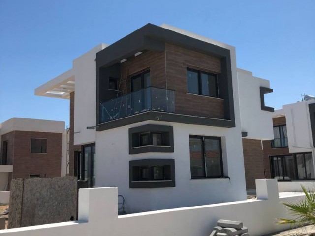 In Iskele - Bahçeler, in a complex with a pool, 700 meters from the sea, twin villas with 3+1 rooms, 178 square meters, are for sale. We can speak Turkish, English and Russian.