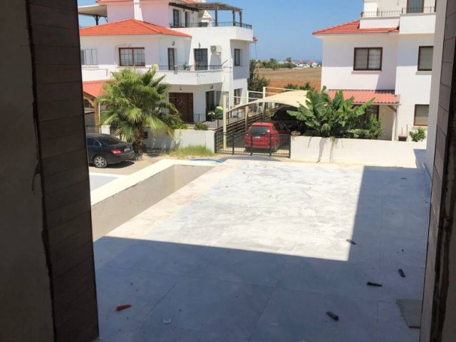 In Iskele - Bahçeler, in a complex with a pool, 700 meters from the sea, twin villas with 3+1 rooms, 178 square meters, are for sale. We can speak Turkish, English and Russian.