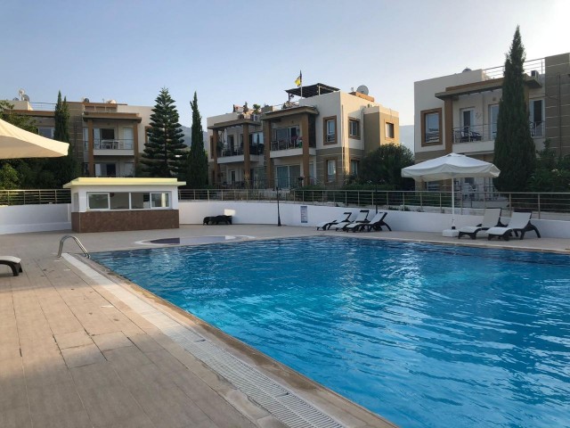 1+1 flat for rent in Kyrenia - Alsancak, in a complex with a large pool and children's playground.