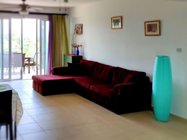 2+1 flat in Tatlısu is for sale with private garden, furniture and white goods. We speak Turkish and English.