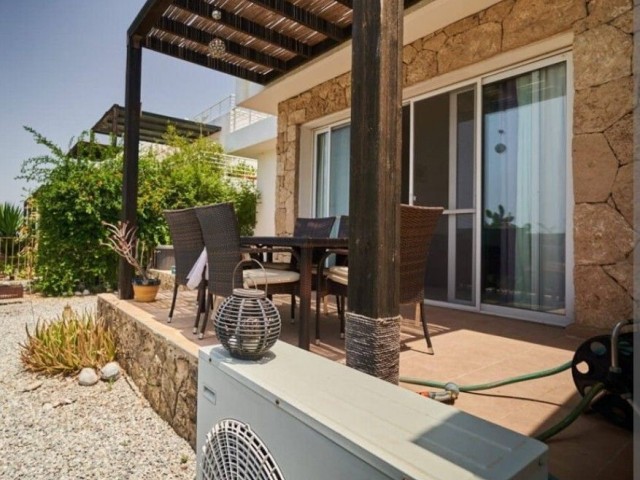 2+1 flat in Tatlısu is for sale with private garden, furniture and white goods. We speak Turkish and English.