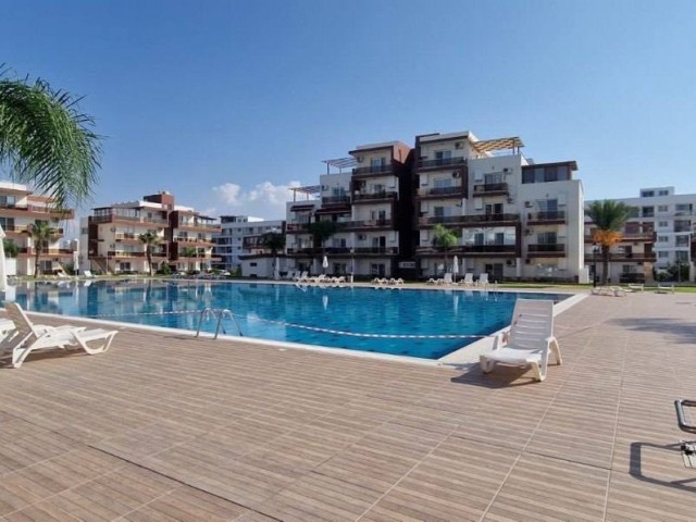 A furnished studio with white goods is for sale in Iskele - Long Beach, RoyalSan Complex. It overlooks the pool.