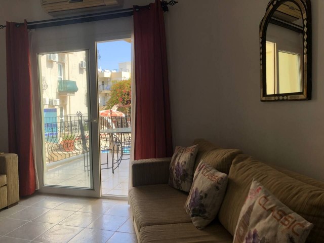 Furnished 2+1 flat with swimming pool for sale in Kyrenia-Alsancak. Discounted price.