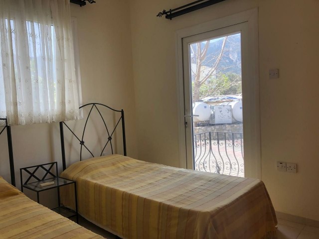 Furnished 2+1 flat with swimming pool for sale in Kyrenia-Alsancak. Discounted price.