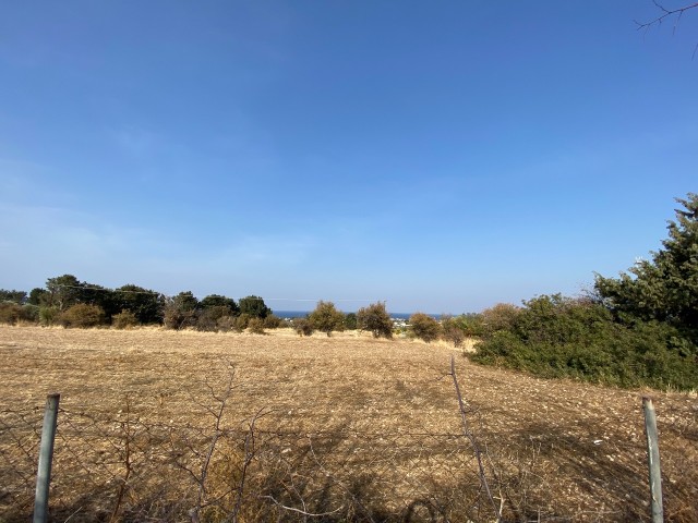 Land for sale in Karşıyaka, on a sloping land, with sea view, Turkish headband, around 9 donums ** 