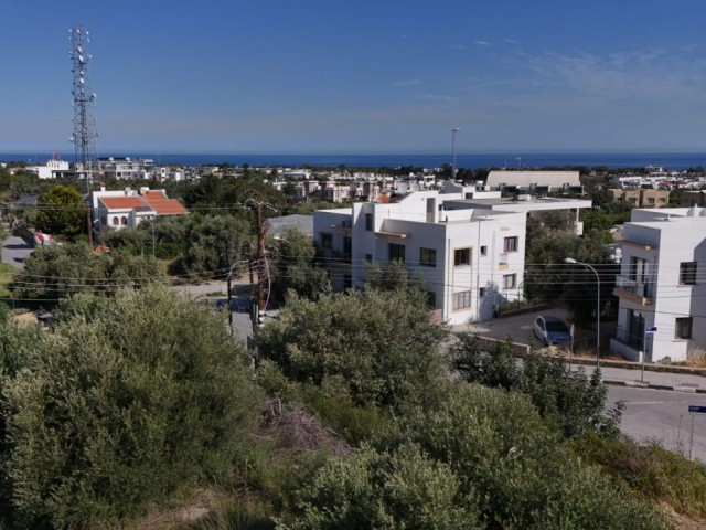 TÜRK KOÇANLI 1217m2 Grundstück zum Verkauf in Kyrenia Zeytinlik mit voller Aussicht in zentraler Lage