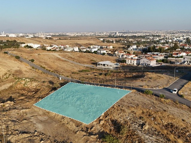700m2 land for sale in Nicosia Gönyeli region, suitable for the construction of a 400m2 villa, with full mountain and city views.