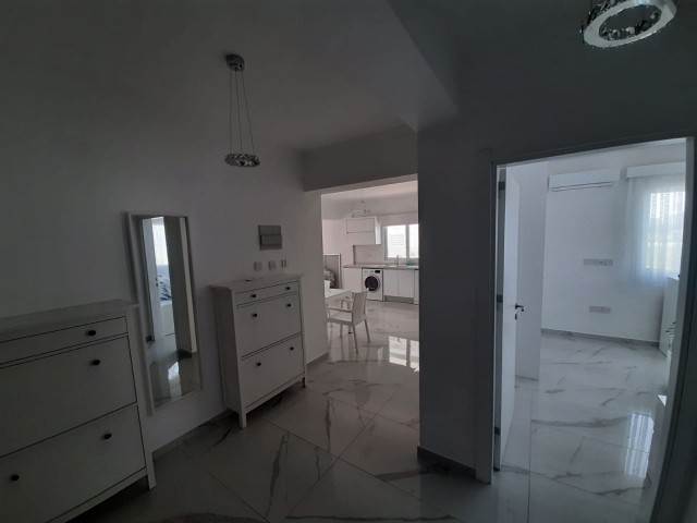 FURNISHED 2+1 FLAT WITH PARKING PARKING ON THE 1ST FLOOR FOR SALE IN İSKELE LONG BEACH AREA