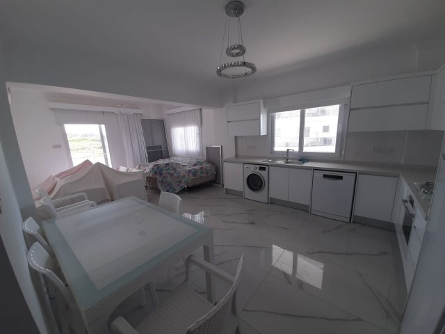 FURNISHED 2+1 FLAT WITH PARKING PARKING ON THE 1ST FLOOR FOR SALE IN İSKELE LONG BEACH AREA