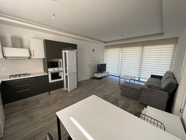 New 2+1 flat for sale in Alsancak, in a site with a pool, fully furnished, with its own terrace and barbecue area and with Sea view.